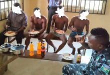 DPO Felix Ekpoudom with detained suspects eating on 2021 Christmas day
