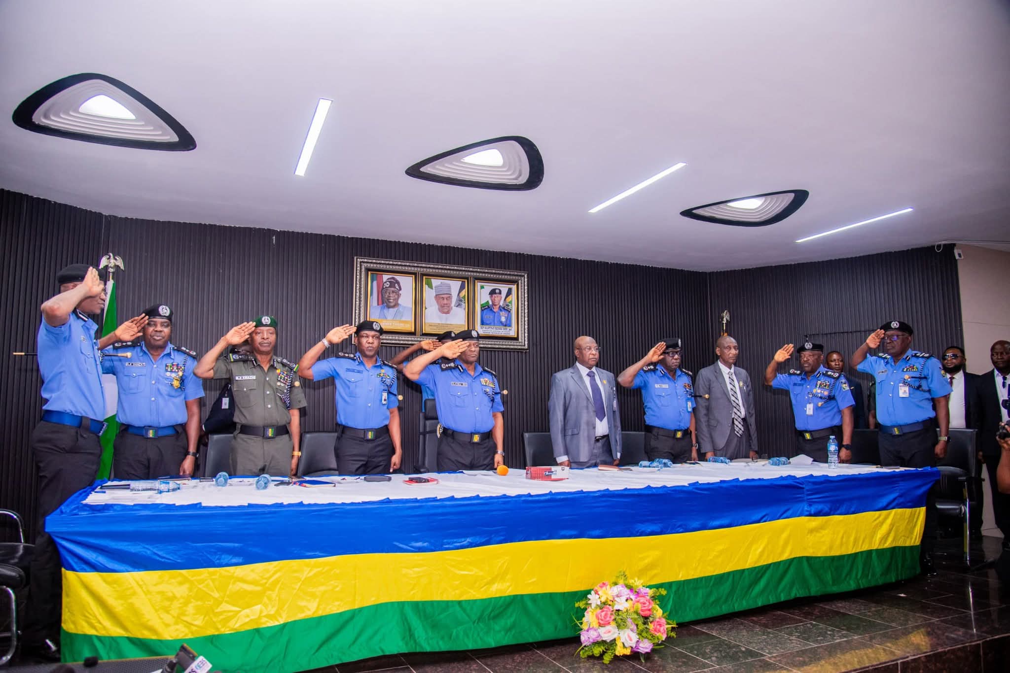 • DIG Frank Mba (4th from left) salutes