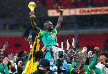 • Senegal players celebrate with the trophy after winning the Africa Cup of Nations final on January 18, 2026. (Franck Fife/AFP/Getty Images)