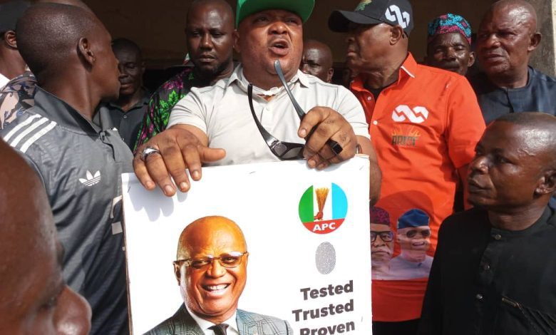 • Hon (Ukai) Ekikere Joshua Udo displaying Governor Umo Eno’s poster during the governorship primary elections in Ini, on Thursday