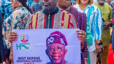 • Prince Ukpong Akpabio displaying President Tinubu's poster during the presidential primary election in Ukana West ll Ward in Essien Udim LGA