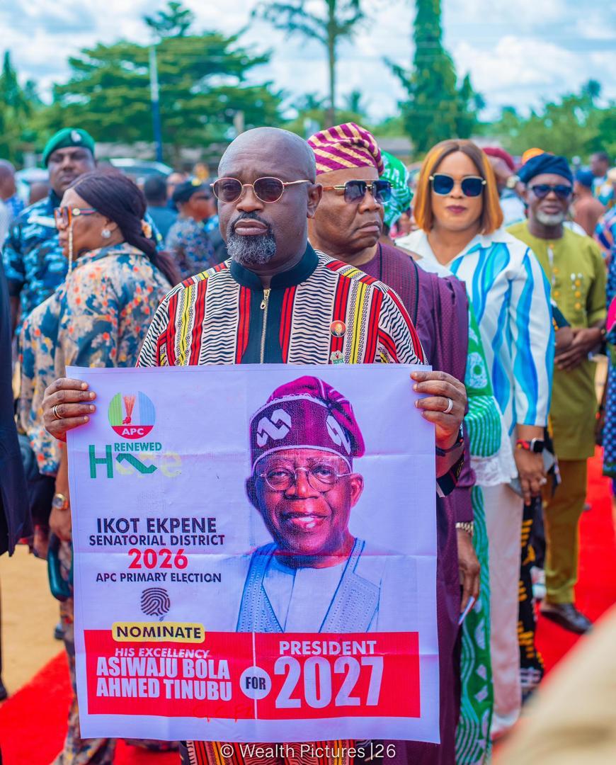 • Prince Ukpong Akpabio displaying President Tinubu's poster during the presidential primary election in Ukana West ll Ward in Essien Udim LGA