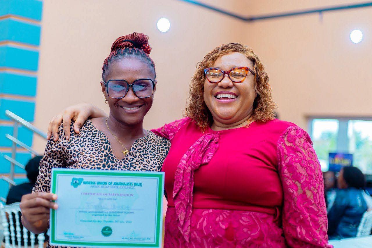 NUJ leadership summit charts new course for professionalism, union growth in Akwa Ibom 16 • Secretary of Apex Chapel, Comrade Grace Anderson (R) savouring the moment with a member of her Chapel, Comrade Evelyn Edidiong Udobia