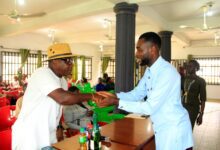 • Akpanusoh (L) exchanging pleasantries with the Chairman of NUJ, Comrade Nsibiet John